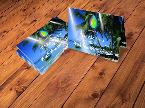 Two stacks of business cards with FAS Printing logo
